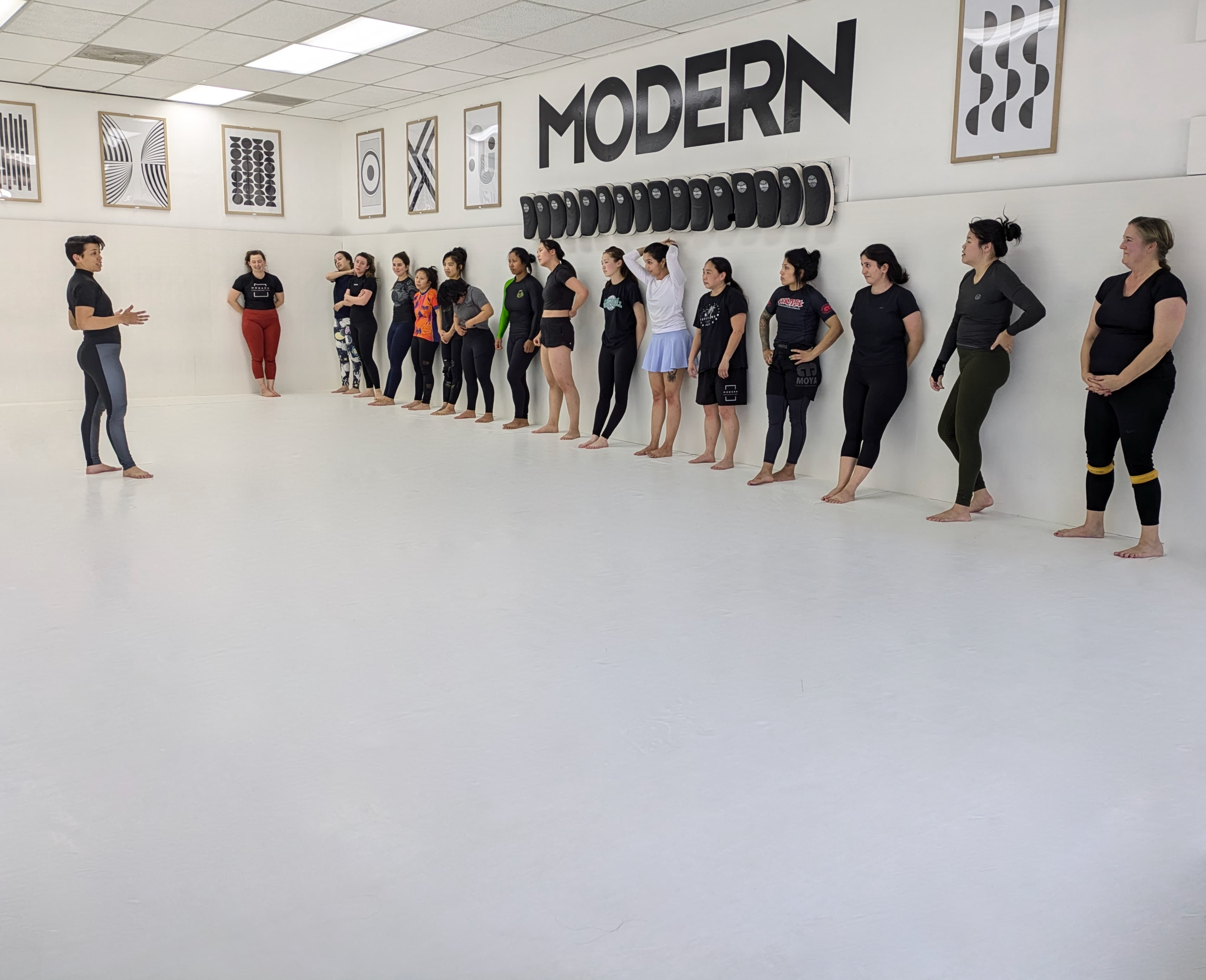 Women practicing Jiu-Jitsu techniques during the class