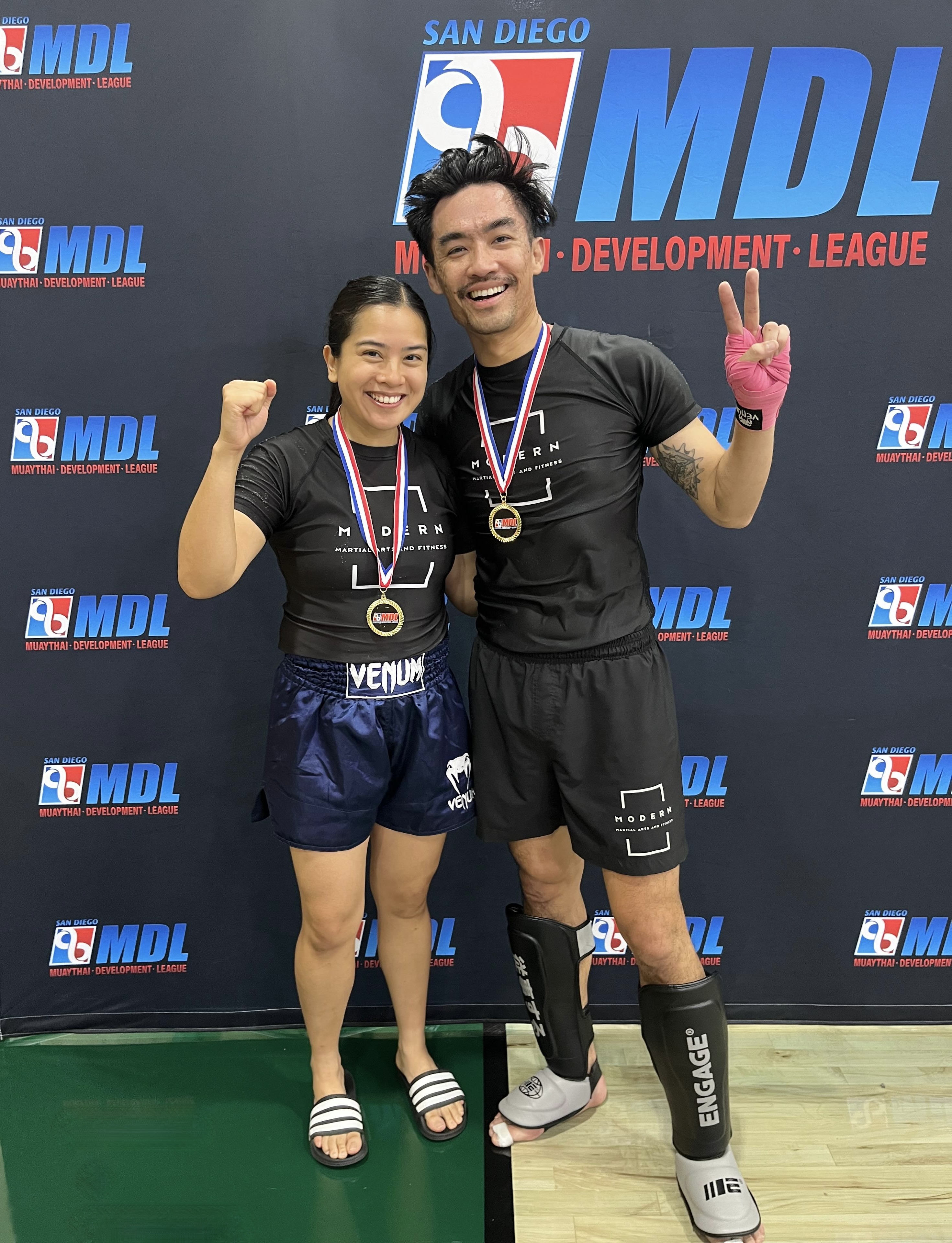 Loc Le and Rachel Corapi celebrating with their medals at MDL San Diego XI